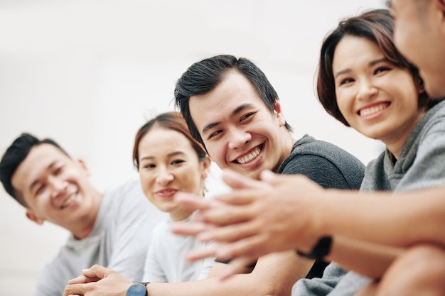 group-happy-smiling-young-people-looking-their-friend-tellig-funny-story-selective-focus_274689-21294.jpg