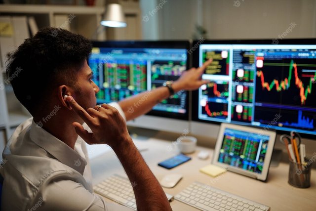 emotional-trader-pointing-stock-chart-data-when-calling-his-colleague-client_274689-24652 (1).jpg