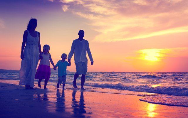 Family-Holidays-by-Holiday-Hamster-Family-walking-on-the-beach-at-sunset.jpg