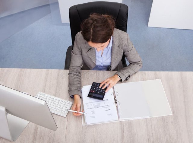 female-accountant-high-angle-view-young-calculating-bills-44600382.jpg