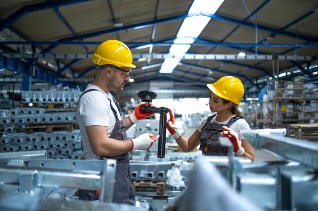 workers-checking-parts-manufactured-factory_342744-140.jpg