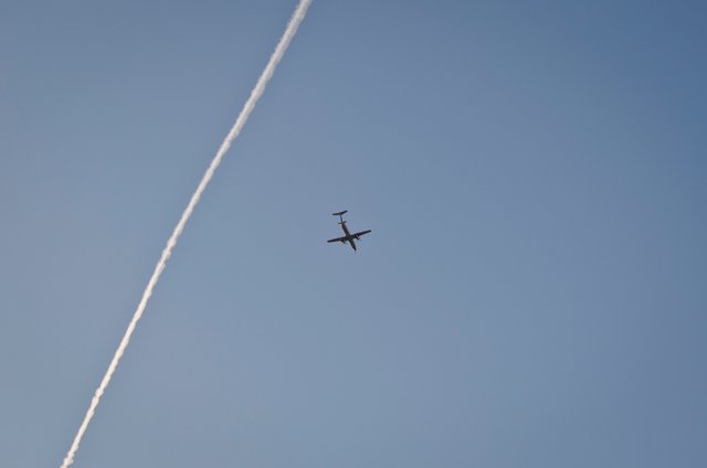 Blue skies and a plane in the air. .JPG