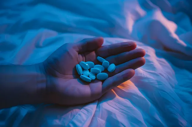 hand-with-pills-dark-environment_23-2151459278.webp