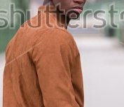 stock-photo-handsome-black-man-looking-back-over-his-shoulder-578991277 a.jpg