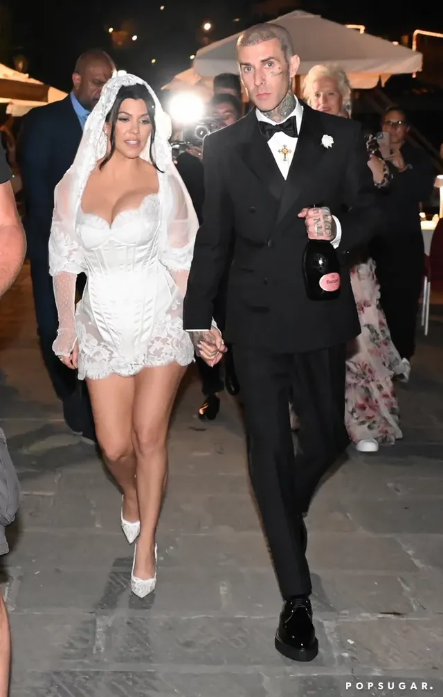 Kardashian-look-was-complete-with-white-lace-bridal-pumps.webp