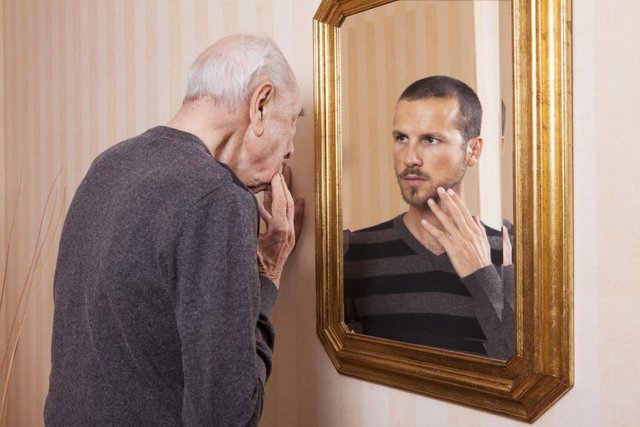 old-man-looking-at-younger-reflection.jpg