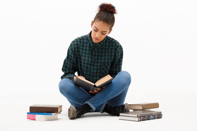 portrait-young-african-woman-with-books-white.jpg