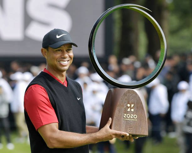 tiger-woods-poses-with-his-trophy-after-winning-the-zozo-championship-picture-id1178638175.jpg