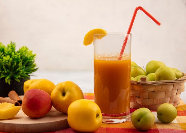 side-view-sweet-yellow-peaches-wooden-kitchen-board-with-pinky-orange-peach-with-peach-juice-with-green-cherry-plums-bucket-checked-tablecloth-white-background_141793-27623.jpg