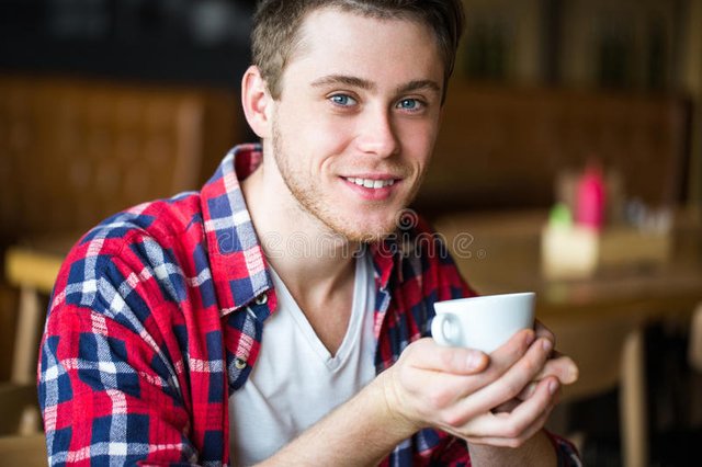 man-drinking-coffee-cafe-man-holding-cup-coffee-tea-burger-concept-67698367.jpg