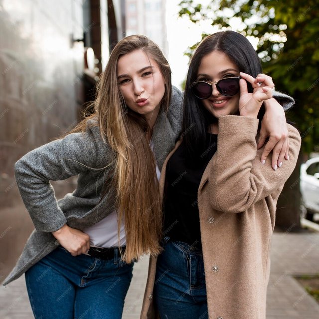 best-friends-posing-fashion-way_23-2148650458.jpg