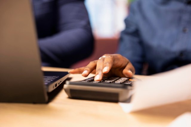 man-woman-reviewing-bills-financial-documents-track-expenses_482257-119299.jpg