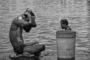 free-photo-of-men-sitting-and-washing-in-river.jpeg