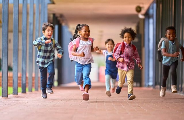group-multicultural-elementary-school-pupils-running-along-walkway-outdoors-school_1218270-6173.jpg