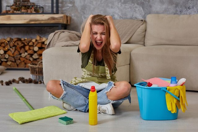 frustrated-young-woman-sitting-living-room-floor-with-blue-bucket-fulfilled-with-chemicals-facilities-tidying-up-screaming_157927-18171.jpg