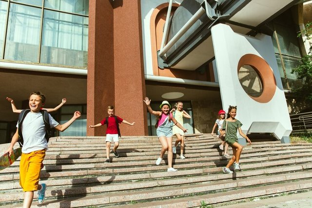 happy-kids-playing-city-s-street-sunny-summer-s-day-front-modern-building-group-happy-childrens-teenagers-having-fun-together-concept-friendship-childhood-summer-holidays_155003-25105.jpg