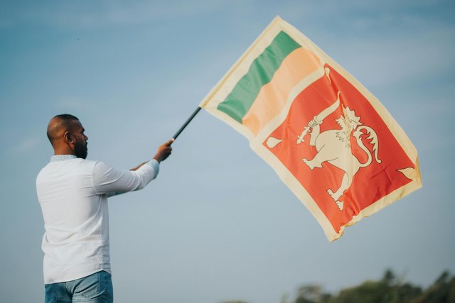 free-photo-of-a-man-holding-a-flag.jpeg