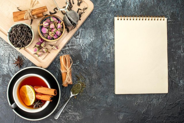 top-view-lemon-tea-cup-kettle-gray-background-color-morning-breakfast-photo-food-ceremony_140725-159393.jpg