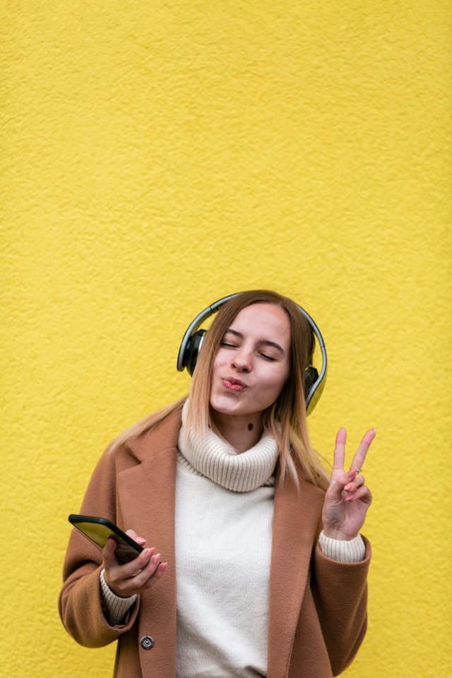 modern-blonde-woman-listening-music-headphones.jpg