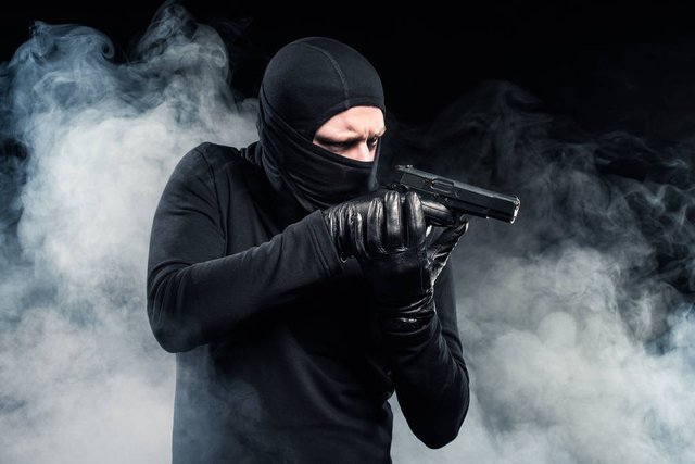 stock-photo-robber-balaclava-gloves-aiming-gun.jpg