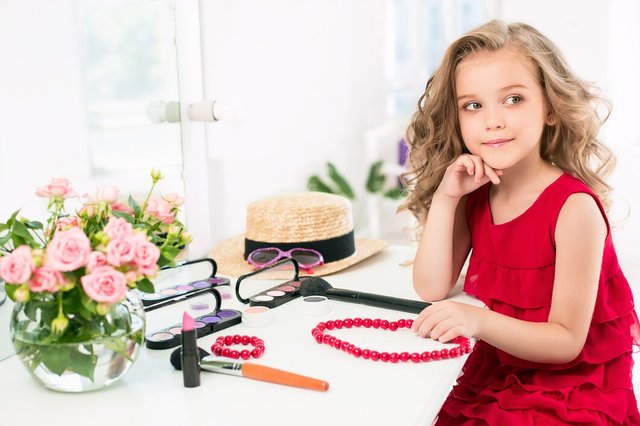 little-girl-with-cosmetics-she-is-mother-s-bedroom-sitting-near-mirror_155003-13919.jpg