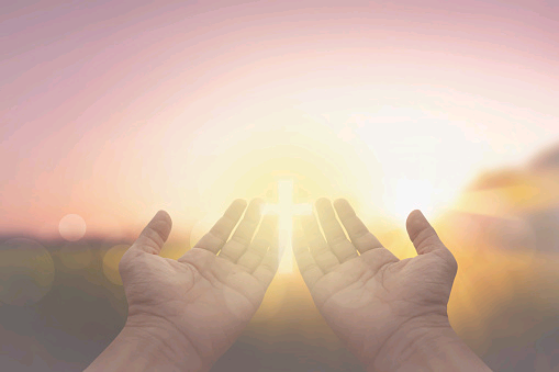 hand-and-jesus-at-sunrise-nature-background.jpg