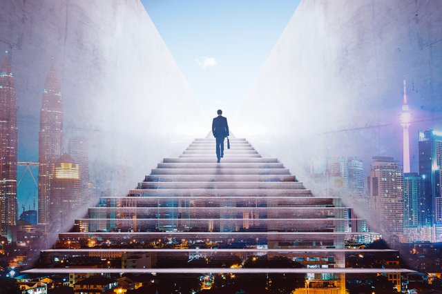 rsz_graphicstock-rear-view-of-a-businessman-climbing-stairs-to-get-to-a-large-city-center-concept-of-success-and-appreciation-double-exposure_hdipxnwejx.jpg