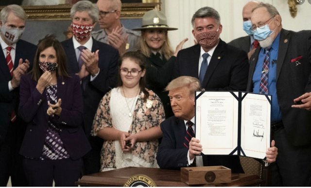 Trump signs Bill.jpg