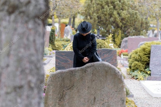 depositphotos_126183040-stock-photo-woman-in-mourning-praying-at.jpg