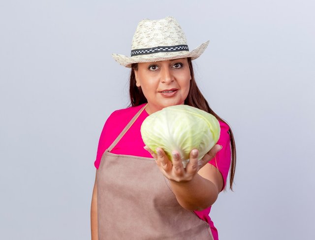 middle-aged-gardener-woman-apron-hat-showing-cabbage-smiling-confident_141793-102458.jpg