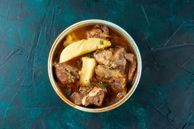 top-view-meat-soup-with-potatoes-inside-dark-blue-desk-meat-vegetable-food-dinner-color_140725-30785.webp