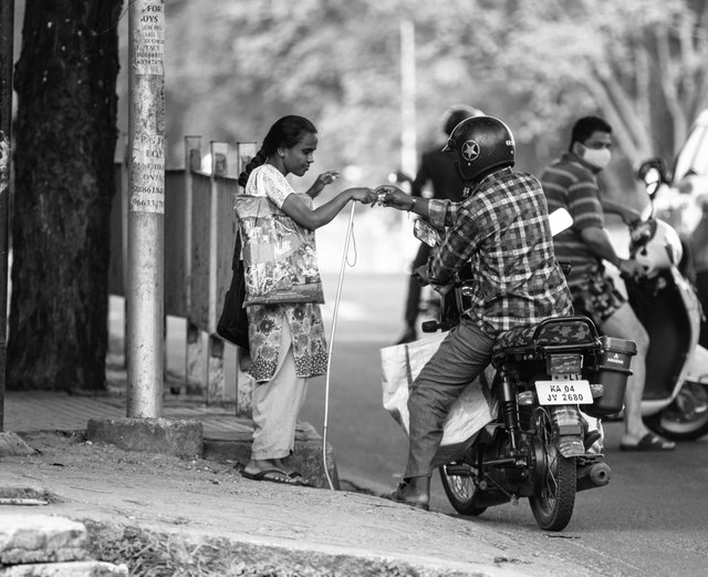 free-photo-of-street-scene-of-kindness-between-pedestrian-and-motorcyclist.jpeg