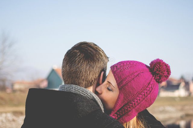 young-woman-kissing-her-boyfriend-s-neck-closeup-outdoors-portrait-women-happy-people-love-enjoying-outdoors-winter-38696221.jpg