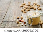 stock-photo-peanut-butter-on-a-dark-wood-background-tinting-selective-focus-265552706.jpg