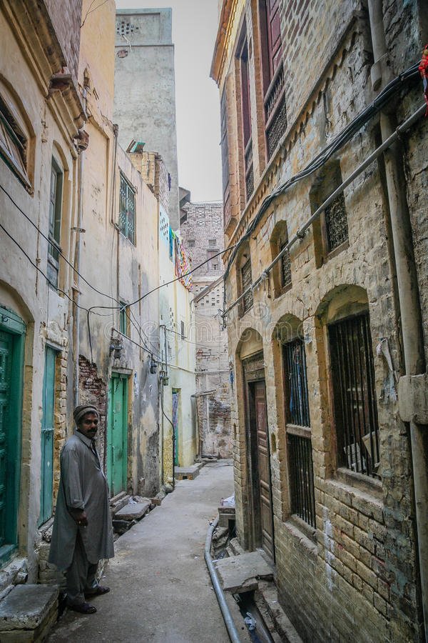 pakistani-men-multan-old-town-man-walking-narrow-street-pakistan-52304731.jpg