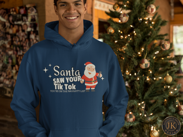 mockup-of-a-man-wearing-a-hoodie-in-front-of-a-beautiful-christmas-tree-23510.png