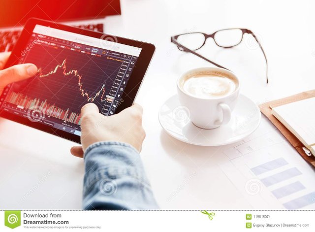 investor-watching-change-stock-market-tablet-cryptocurrency-trading-platform-119816074.jpg