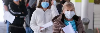 hero-1920-640-people-wait-in-line-covid-19-vaccination-site-shutterstock_1935753865.jpg