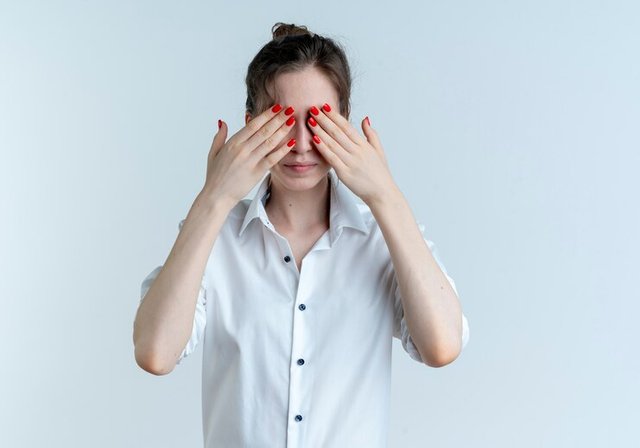 young-blonde-russian-girl-closes-eyes-with-hands-isolated-white-space-with-copy-space_141793-60119.jpg