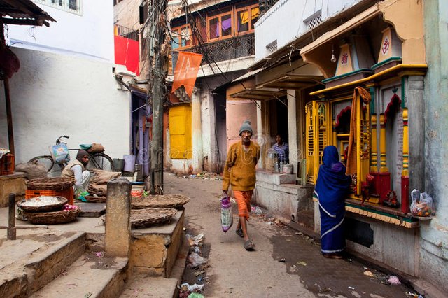 traditional-street-life-sellers-praying-woman-passers-people-varanasi-india-morning-varanasi-urban-33459428.jpg