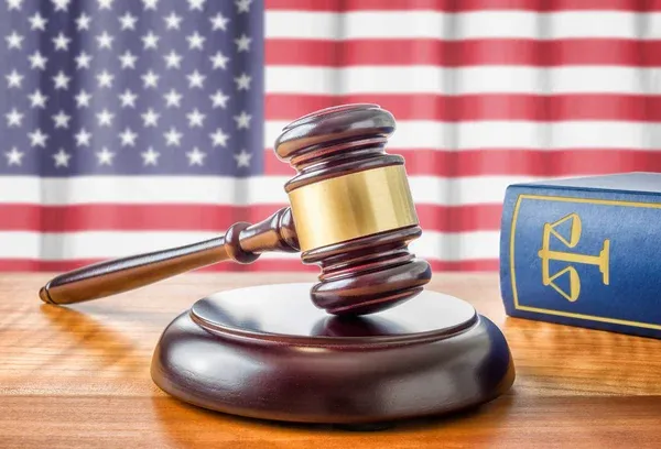 depositphotos_76616171-stock-photo-a-gavel-and-a-law.jpg