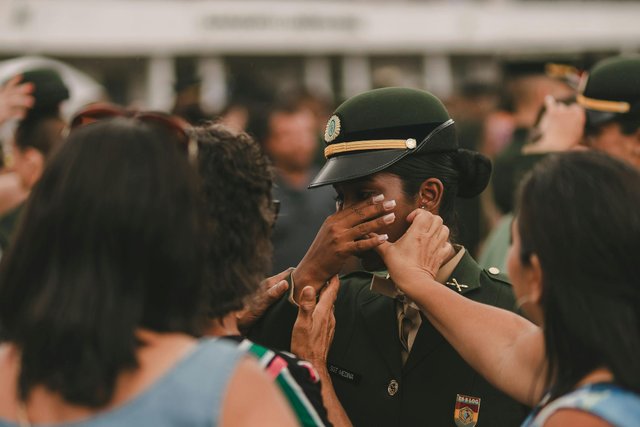 free-photo-of-people-comforting-a-crying-woman-in-a-military-uniform.jpeg