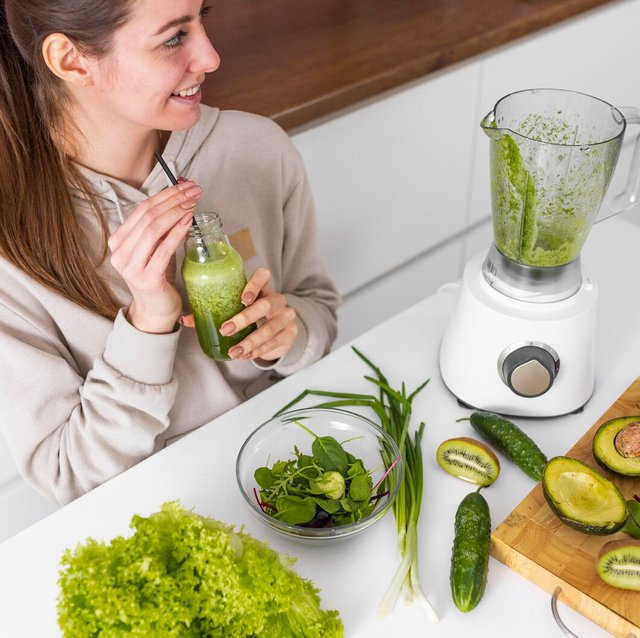 close-up-smiley-woman-with-smoothie_23-2148898593.jpg