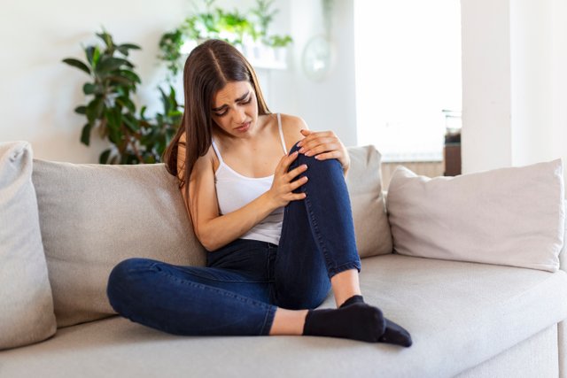 woman-holding-knee-with-pain-sofahealth-care-medical-concept.jpg