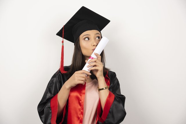 fresh-graduate-kissing-her-diploma-white-background (1).jpg