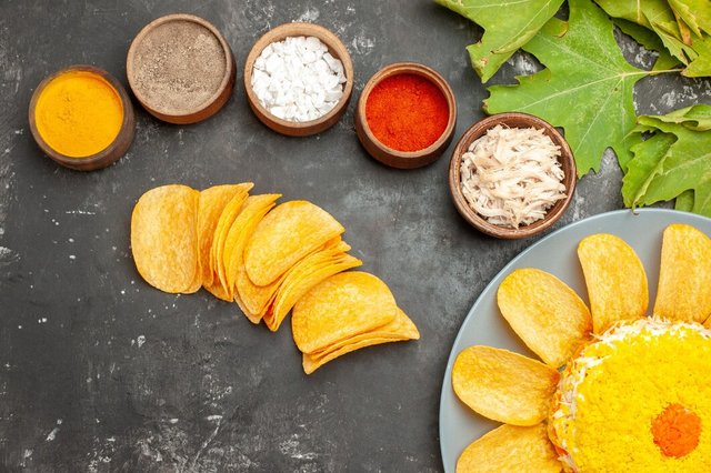 top-view-salad-bottom-side-with-herbs-chips-leaves-side-dark-grey-background_140725-80538.jpg