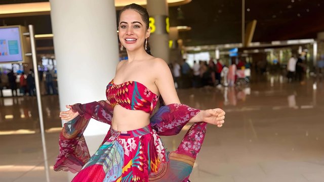 Urfi Javed Spreads Festive Cheer with Vibrant Lehenga Look at Mumbai Airport.jpg