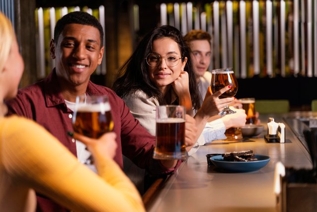 close-up-friends-sitting-with-beer.jpg