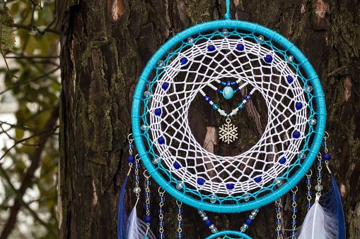 handmade-dream-catcher-with-feathers-threads-and-beads-rope-hanging-picture-id1141220374.jpg