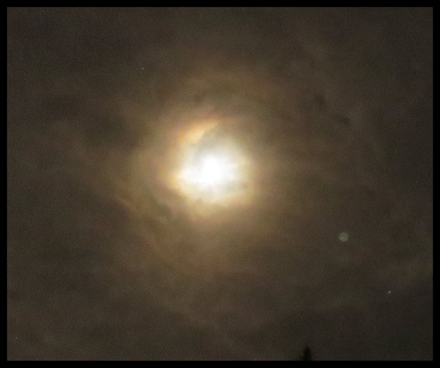 flash puts on orange color clouds highlighted form tunnel to full moon.JPG
